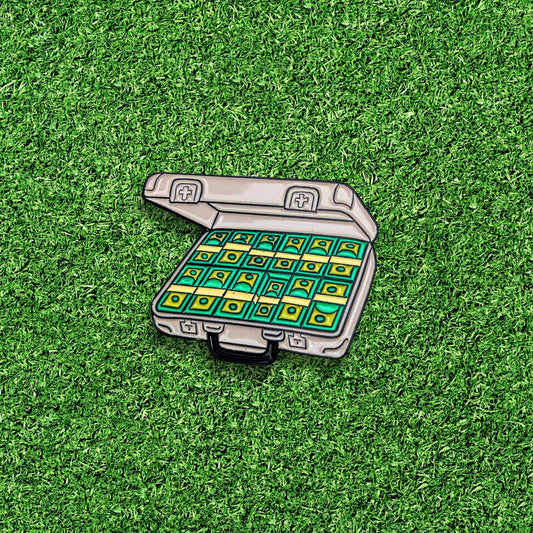 golf ball marker of stacks of green cash money inside an open grey briefcase