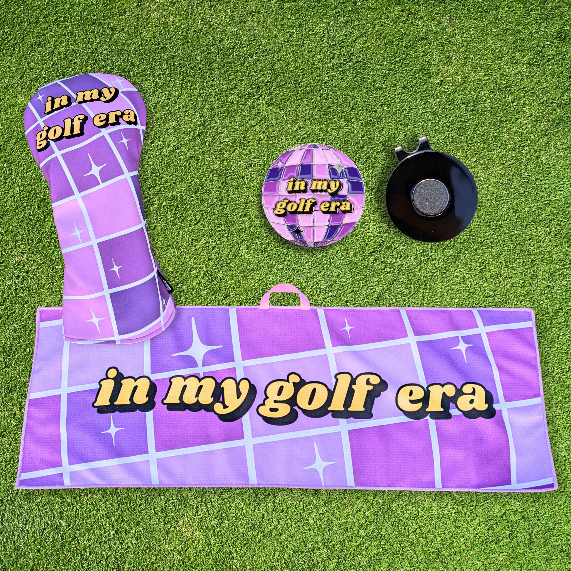 purple swiftie golf gift set that includes headcover, towel, and ballmarker with mirrorball design that says 'in my golf era'
