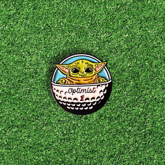 golf ball marker of green star baby in golf ball spaceship